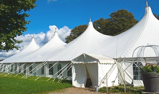 a line of sleek and modern porta potties ready for use at an upscale corporate event in Gretna